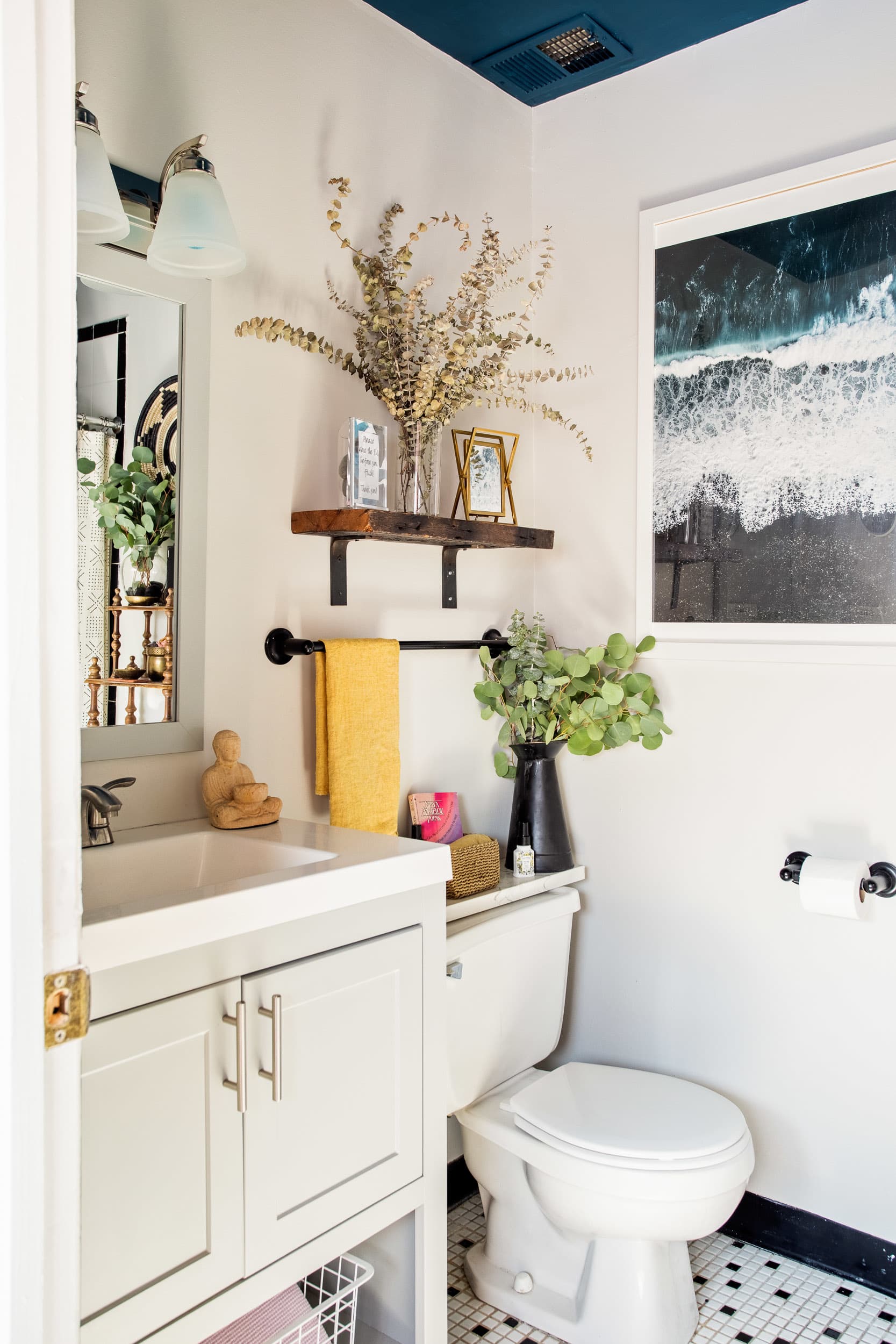 Towel cabinet over online toilet